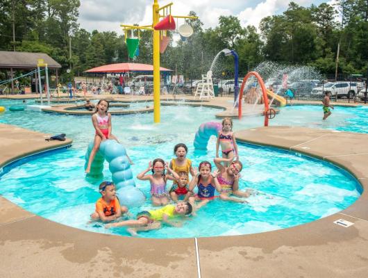 Kids splashing in the activity pool